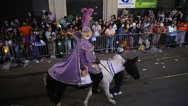 Mardi Gras parade float with riders tossing beads